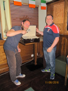 A delighted but seemingly hungry winner is Mr. David Rooney of President Padraic Clarke's beautiful prize. 